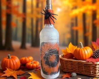 Botella iluminada con forma de telaraña de Halloween