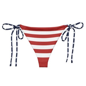 American flag bikini, USA swimsuit, patriotic bikini, stars and stripes bikini, Fourth of July swimwear, red white blue bikini, women’s patriotic swimsuit, American flag swimsuit, summer beach bikini, USA flag two-piece, spaghetti strap bikini, Independence Day bikini, USA pride swimwear