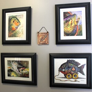 An arrangement of four lake art watercolor illustrations by famous fish artist Barry Singer