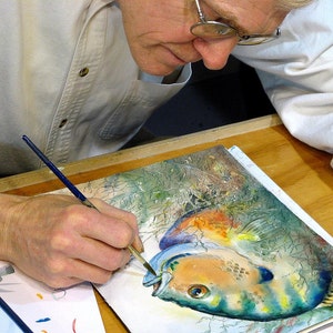 Barry Singer painting a Bluegill in watercolors..