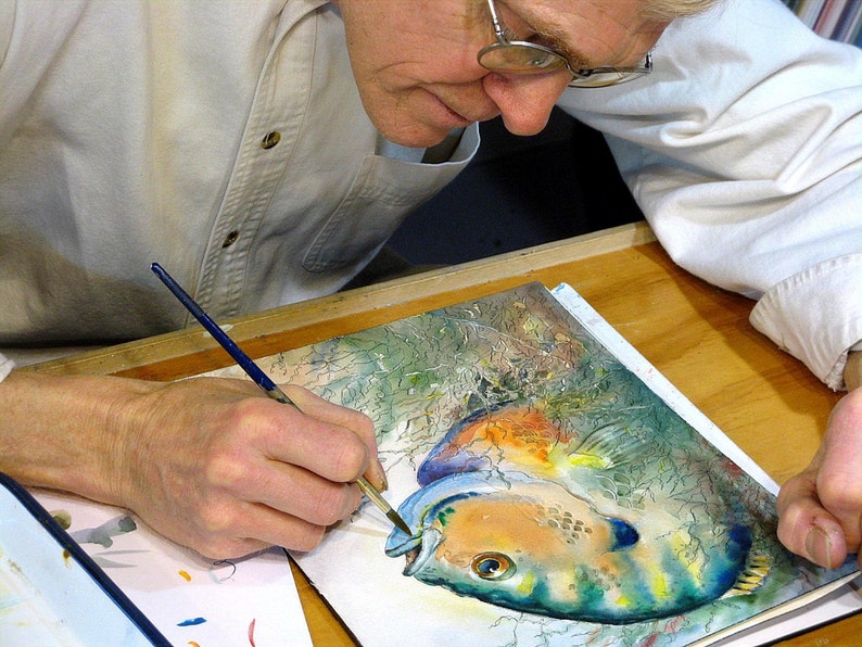 Barry Singer painting a Bluegill in watercolors..