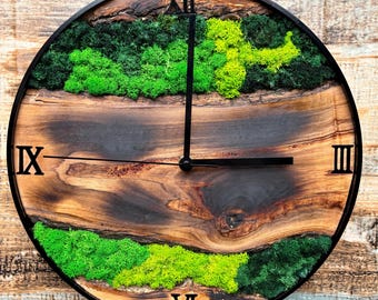 flamed, handmade wall clock made of real olive wood and preserved moss