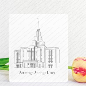May include: A black and white line drawing of the Saratoga Springs Utah Temple. The drawing is on a white background with the text "Saratoga Springs Utah" below the drawing.