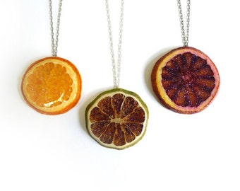 Spoiled Rotten JewelryJuicy slice pendantUnique bone and dried blood orange necklace