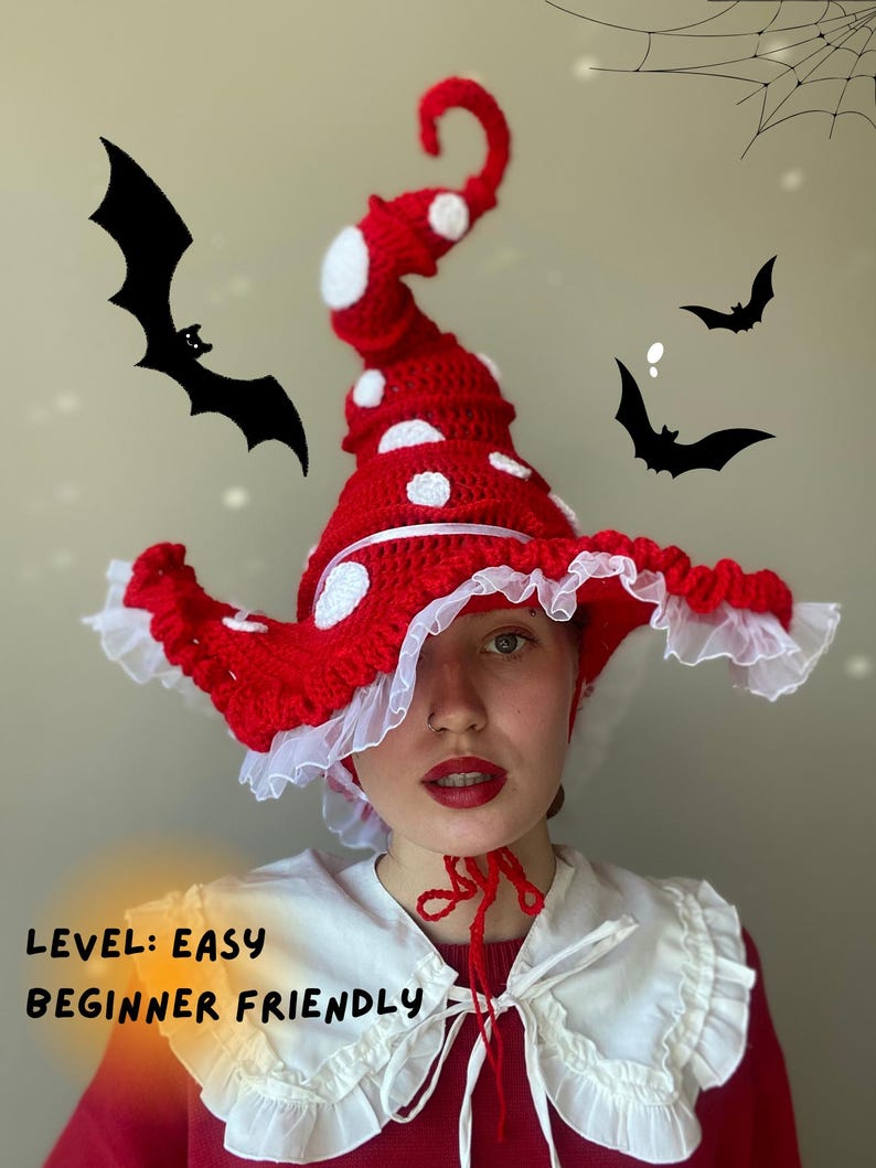 May include: A red and white crocheted mushroom hat with white polka dots and a ruffled brim. The hat has a tall, curved top and is labeled "Level: Easy Beginner Friendly". Black bat silhouettes are in the background.