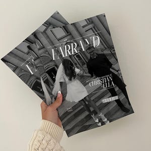 Op de afbeelding: Twee exemplaren van het tijdschrift "Farrand" worden in een hand gehouden. De omslag van het tijdschrift toont een zwart-witfoto van een stel, met de tekst "Let's celebrate the marriage of CHRISTIAN + ELLA" en "MAY 2025". Het tijdschrift heeft een grijswaarden kleurenschema.