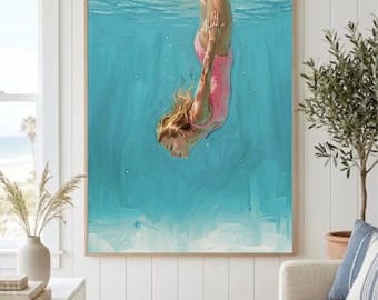May include: A rectangular wall art print featuring an oil painting of a person with blonde hair wearing a pink swimsuit, diving vertically into vibrant turquoise water. The artwork is encased in a thin, light-toned wooden frame.