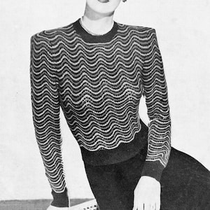 May include: A black and white knitted sweater with a wavy pattern. The sweater has a round neckline and long sleeves. The knitting pattern is a simple wave design. The sweater is made with 5 ounces of 3-ply yarn in the main color and 2 ounces each of two contrasting colors. The text "SMART JUMPER" is printed above the image.