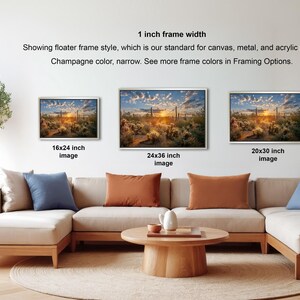 a living room with a large sectional sofa, a coffee table, and a potted plant. There are four framed landscape paintings displayed on the wall, each with a different frame size ranging from 16" to 20" inches. The paintings are arranged in a row, creating a cohesive and visually appealing display.