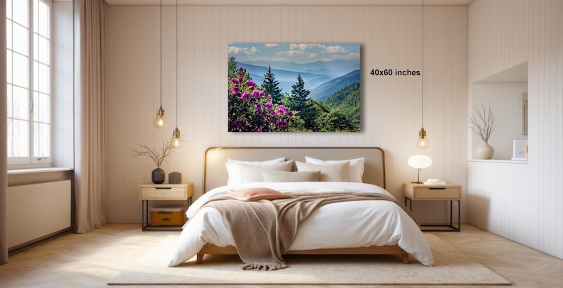a serene bedroom with a large bed, wooden furniture, and a painting of a mountain landscape hanging on the wall.