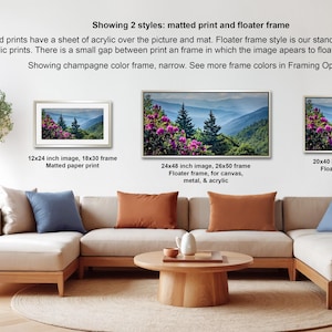 a living room with a large, comfortable couch and a coffee table. There are three framed prints displayed on the wall, each with a different frame style and size. The text provides information about the framed prints, including their sizes and frame styles.