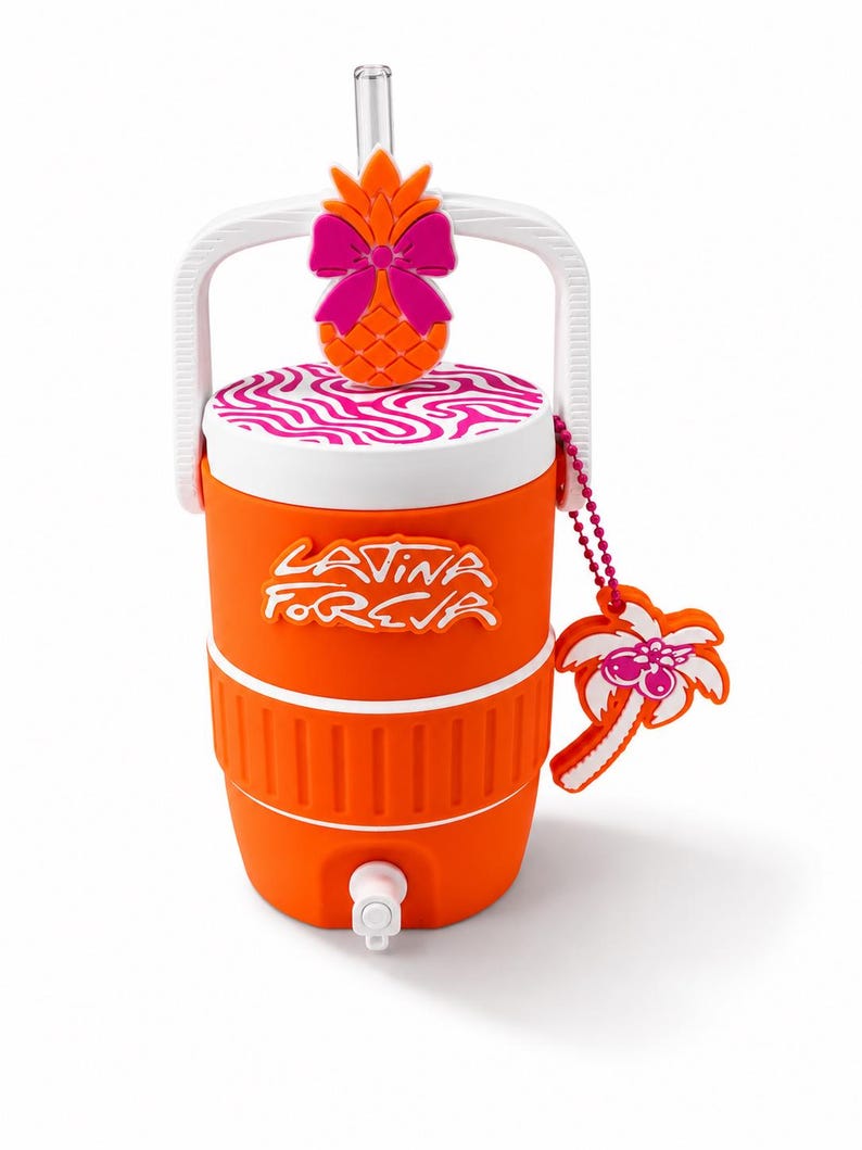 May include: An orange beverage cooler with a white handle and a white spigot at the base. The lid features a pink and white wavy pattern and an orange pineapple topper with a pink bow. The text "LATINA FOREVA" is in white, and a palm tree charm hangs.