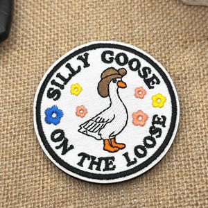 Silly Goose on the Loose Embroidered Velcro Patch – Funny Cute Goose with Cowboy hat and floral details Patch for Backpack, Jacket, Hat