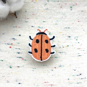 thumbnail image 2 of Ladybird Flower Patch – Embroidered Iron-On/Sew-On Badge (UK Theme) 2 of 6
