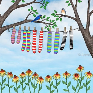 May include: A line of colorful striped socks hangs on a clothesline between two trees. Two bluebirds perch on a branch above the socks. A row of yellow flowers grows in the foreground.