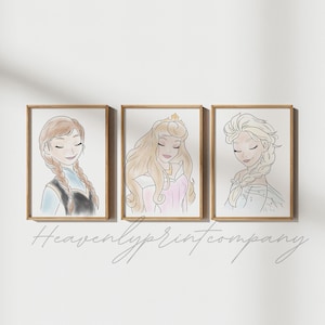 May include: Three framed watercolor prints featuring illustrations of princesses. The first print shows a princess with brown hair in braids, the second a princess with long blonde hair, and the third a princess with blonde hair in a braid. The text "Heavenlyprintcompany" is below the prints.