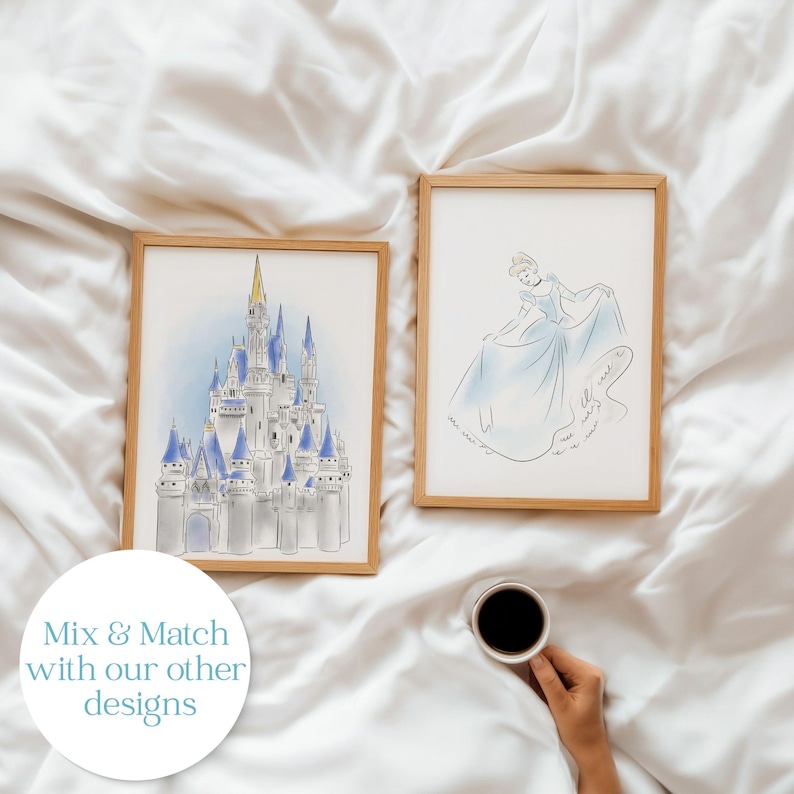 May include: Two framed art prints featuring watercolor illustrations. One depicts a castle with blue spires and a golden roof, the other a princess in a blue gown. The text "Mix & Match with our other designs" is in a white circle.