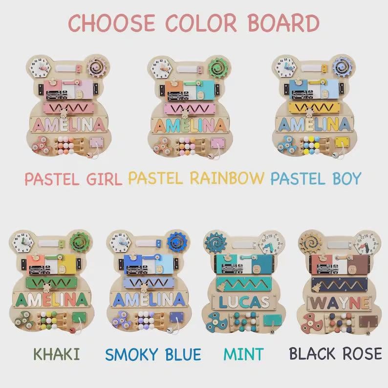 May include: Seven bear-shaped wooden activity boards with various sensory features including clocks, gears, and beads. Each board is personalized with names like AMELINA, LUCAS, or WAYNE, and features distinct color palettes labeled as Pastel Girl, Pastel Rainbow, Pastel Boy, Khaki, Smoky Blue, Mint, and Black Rose.