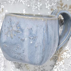 Handcrafted, coffee cup on speckled clay