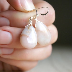 Natural Stone Jasper Earrings in a teardrop shape wire wrapped in Sterling Silver on French hook ear wires.