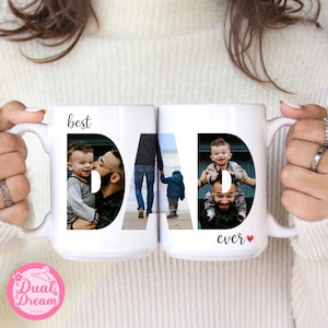 May include: Two white ceramic mugs with the word "DAD" spelled out in large black letters. Each letter contains a photograph of a father and child. The words "best" and "ever" are also printed on the mugs.