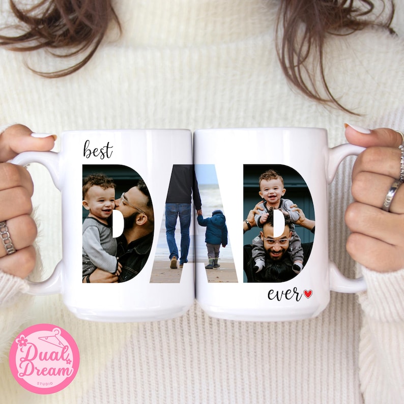 May include: Two white ceramic mugs with the word "DAD" spelled out in large black letters. Each letter contains a photograph of a father and child. The words "best" and "ever" are also printed on the mugs.