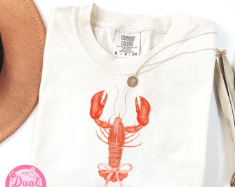 Comfort Colors ロブスター コケット Tシャツ、沿岸カウガール サマーバイブス、レトロサマービーチ、ピンクのリボン付きレトロロブスターシャツ、バケーションシャツ