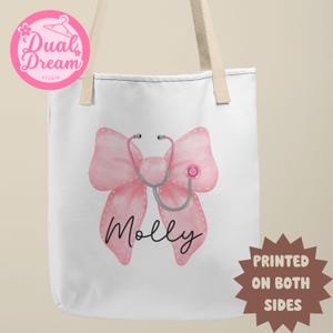 May include: White tote bag with a pink bow and a stethoscope. The name "Molly" is printed below the bow. The bag is printed on both sides.