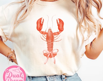 Comfort Colors ロブスター コケット Tシャツ、沿岸カウガール サマーバイブス、レトロサマービーチ、ピンクのリボン付きレトロロブスターシャツ、バケーションシャツ