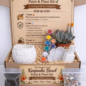 May include: A craft kit in a cardboard box containing a white ceramic bowl with a floral relief pattern, a succulent plant, small paint pots, a palette, a brush, a bottle of sealer, a bag of soil, and a bag of decorative pebbles with instructions.