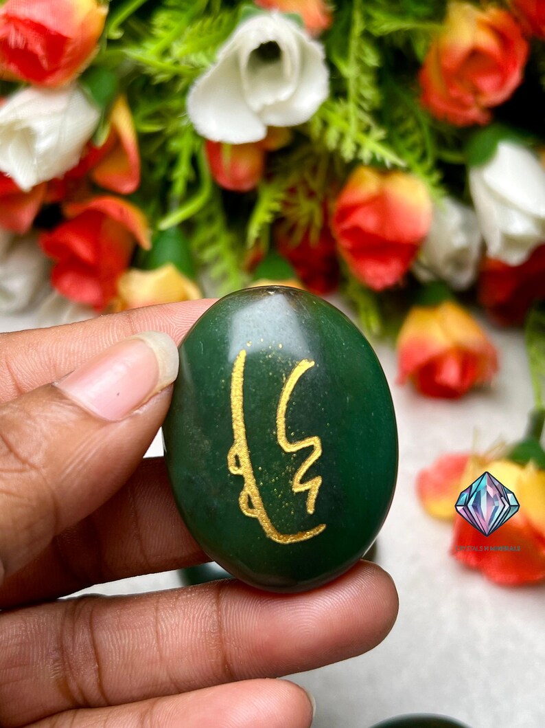 May include: Green stone with a gold symbol, a green stone with a gold symbol, a green stone with a gold symbol, a green stone with a gold symbol, a green stone with a gold symbol, a green stone with a gold symbol, a green stone with a gold symbol, a green stone with a gold symbol, a green stone with a gold symbol, a green stone with a gold symbol.