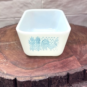 May include: A set of three ceramic mugs with a speckled, matte finish. The mugs are in shades of cream, light gray, and dark gray. Each mug has a simple, modern design and a rounded handle.