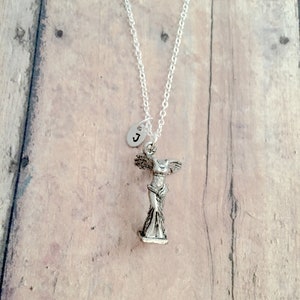 silver nike necklace