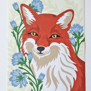 Paint-by-number painting of a red fox surrounded by periwinkle blue chicory flower stalks with a pre-printed background featuring a botanical fern pattern.