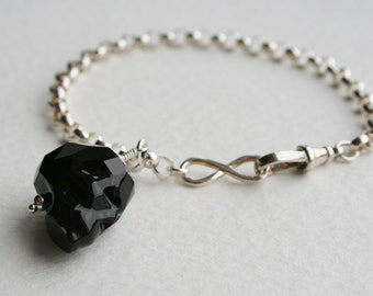 Black Crystal Skull Charm Bracelet Sterling Silver Infinity Clasp