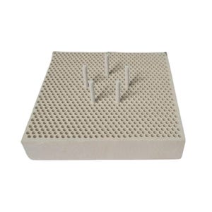 May include: A square, off-white ceramic soldering board featuring a dense grid of small, uniform circular perforations across its top surface. Five small, cylindrical ceramic pins are inserted into the holes, arranged in a central cluster.