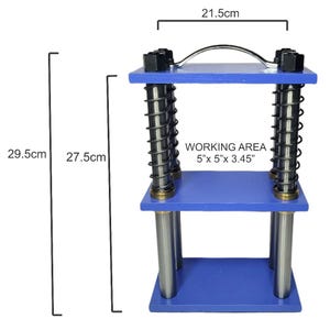 May include: A blue press with a silver handle and springs. The working area is 5" x 5" x 3.45". The press is 29.5 cm tall and 21.5 cm wide.