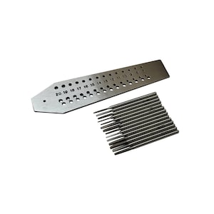May include: A metal gauge with numbered holes and a set of 12 metal drill bits. The gauge has numbers from 7 to 20 printed on it. The drill bits are arranged in a row.