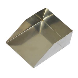 May include: A metallic gold-toned scoop with a wide, open-top design and a flat, angled front edge. The object features a smooth, reflective surface with clean, sharp geometric lines and a deep, tapered basin for collecting or transferring dry goods.