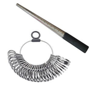 May include: A set of silver metal ring sizers and a tapered ring mandrel with a black handle. The ring sizers are on a metal ring with a black handle. The mandrel has size markings.