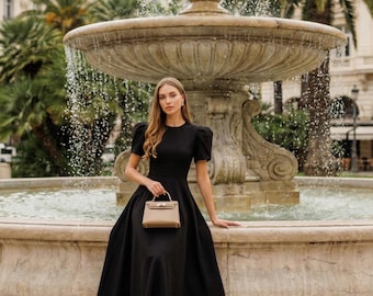 peplum black tie dress Luna Black Peplum Midi Dress With Puff Sleeves and Tie Detail Perfect for Formal Events, Office Chic, and Modern Feminine Style