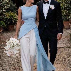 May include: A set of three ceramic mugs with a speckled, matte finish. The mugs are in shades of cream, light gray, and dark gray. Each mug has a simple, minimalist design, perfect for coffee or tea.