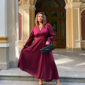 Plus Size Wrap Dress in Plum with Loose Cuffed Sleeves and Flared Skirt