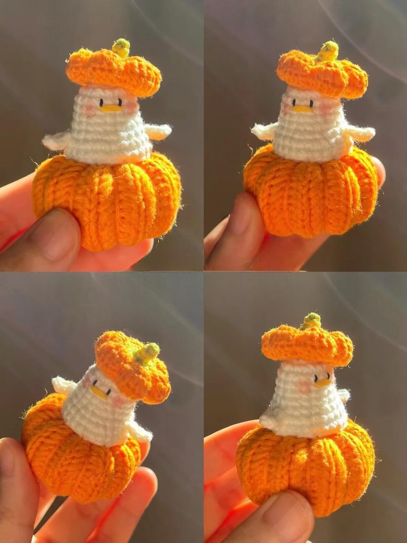 May include: A handmade crochet pumpkin-themed figurine. The figurine features an orange pumpkin base, a white body, and an orange hat. The face has small black eyes and a yellow beak. The arms are white and outstretched. The figurine is a whimsical fall decoration.