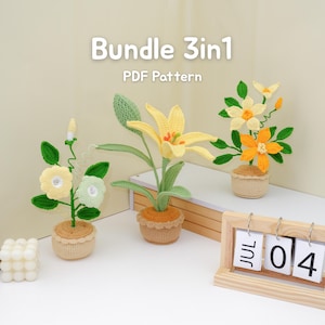 May include: Three crochet flower arrangements in pots. The flowers are yellow, orange, and white with green leaves. The text "Bundle 3in1 PDF Pattern" is at the top. A wooden calendar shows "JUL 04".