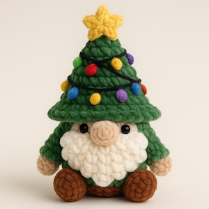 May include: A handcrafted Christmas gnome featuring a green tree-shaped hat decorated with colourful lights and a yellow star. The gnome has a white beard, a beige nose, and brown feet. A festive decoration for the holiday season.
