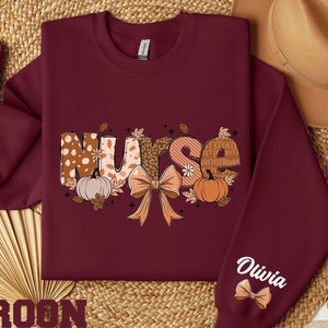 Custom Fall Nurse Shirt, Personalized Nurse Pumpkin Sweatshirt for Nurse Gift for Nurse, Fall Coquette Bow Shirt For Registered Nurse Hoodie