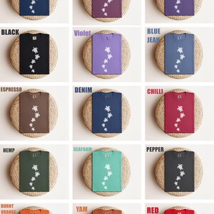 May include: A collection of Comfort Colors t-shirts in various colors, including Midnight, Berry, and Grape. Each shirt features a white turtle graphic. The text "COMFORT COLORS 17171 COLOR OPTIONS" is at the top.