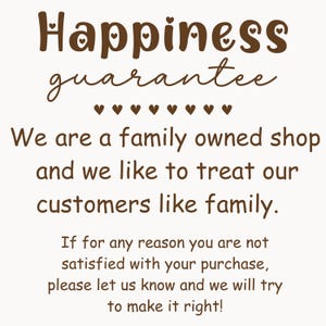 May include: A cream-coloured graphic with the words "Happiness guarantee" in brown script. The text below states, "We are a family owned shop and we like to treat our customers like family."