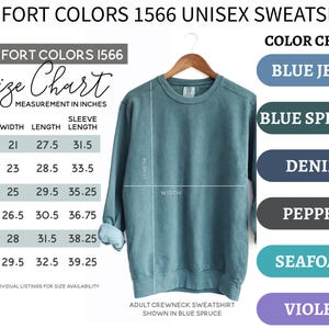 May include: A Comfort Colors 1566 crewneck sweatshirt in blue spruce, displayed with a size chart in inches and a color chart listing blue jean, blue spruce, denim, pepper, seafoam, and violet. The sweatshirt features long sleeves and a ribbed hem.